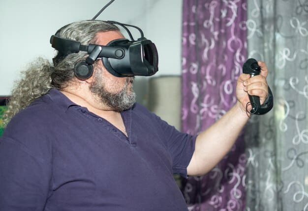 Person using a VR headset with adaptive controllers designed for users with limited hand mobility. The controllers have large buttons and are ergonomically shaped.