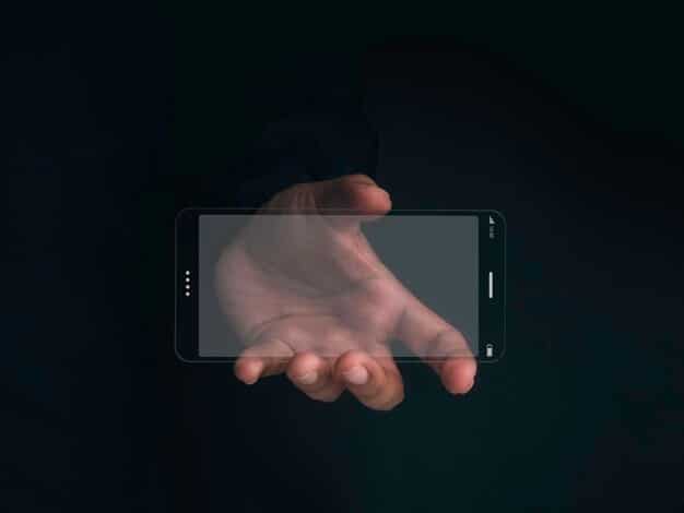 A close-up shot of a hand holding a smartphone, showcasing an AR overlay that allows the user to virtually try on different sunglasses. The AR overlay accurately reflects the lighting and angles, providing a realistic representation of the sunglasses on the user's face.