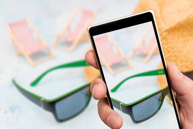 A screenshot of an AR marketing campaign showing a user trying on virtual sunglasses using their smartphone. The sunglasses appear realistically on the user's face in the live camera view.