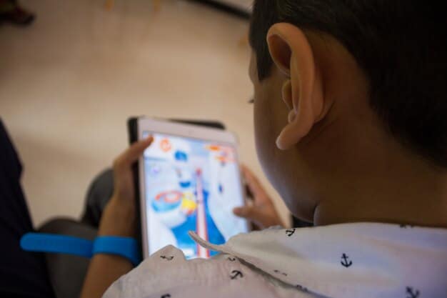 An AR interface displaying the name and occupation of a person in front of a visually impaired individual, facilitating social interaction.