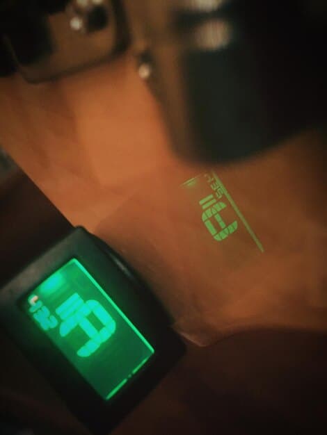 A close-up view of a VR treadmill's control panel, displaying fitness metrics such as speed, distance, heart rate, and estimated calorie burn. The screen shows that the user has burned 350 calories in 45 minutes. The focus is on the data and feedback the machine provides during a workout session.
