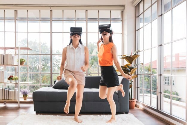 Three people exercising in a VR fitness studio. Each person is on a different VR treadmill, wearing a headset and moving in sync with their virtual environments. One person is navigating a cityscape, another is running through a jungle, and the third is on a race track. The studio is brightly lit with motivational signage and fitness equipment visible in the background, creating a dynamic and energetic atmosphere.