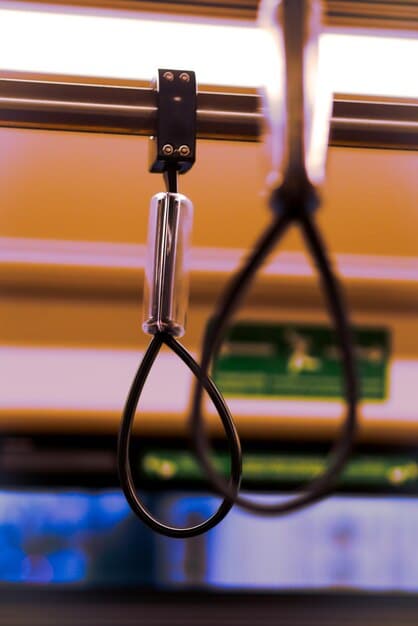 A close-up shot of a well-organized VR cable management system, specifically highlighting the retractable pulley system attached to the ceiling, with the VR headset cable neatly suspended and managed.