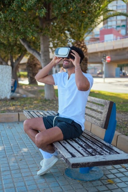 A person sitting on a park bench, engrossed in a mobile VR game using a 5G-connected headset. The scene highlights the portability and seamless connectivity of 5G-enabled mobile VR.