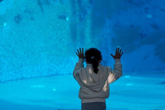 A close-up, slightly blurry screenshot from inside the Subnautica VR game. The player is inside a small submersible vehicle, peering out at a massive, bioluminescent Leviathan creature swimming in the inky blackness. The inside of the submersible is dimly lit, with visible control panels. The scene captures the feeling of being small and vulnerable in the face of the deep sea.